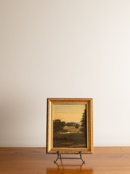American School (19th Century) Cows in a field outside a village., Oil on canvas, 12" x 9.5".
